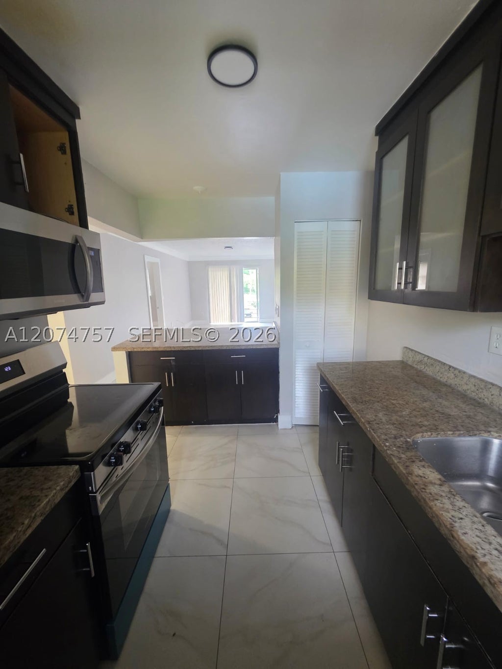 Photo of 4121 Stirling Rd #207, Dania Beach, FL 33314 (MLS # A12074757)