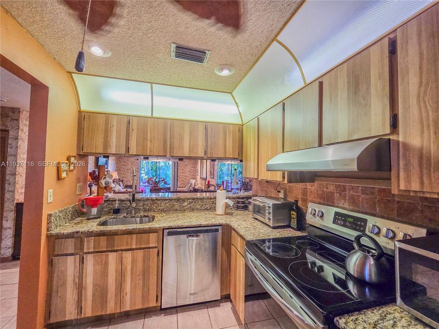 Welcome to Redbridge! This beautifully maintained 2BR/2BA single-story townhome sits on the golf course and features granite kitchen counters, updated baths, impact windows/shutters, wall-to-wall closets, and a new Samsung Hub fridge and 2025 hot water heater. Extras include a generator, fenced patio with built-in outdoor kitchen & Jenn-Air BBQ, new awning, and ample parking. Community pool, top-rated schools. 3 cars parking assigned. Completely furnished, TURNKEY. 3 TVs, cameras, etc. provided.