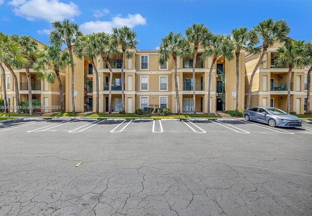 Photo of 733 Riverside Dr #1216, Coral Springs, FL 33071 (MLS # A11980410)