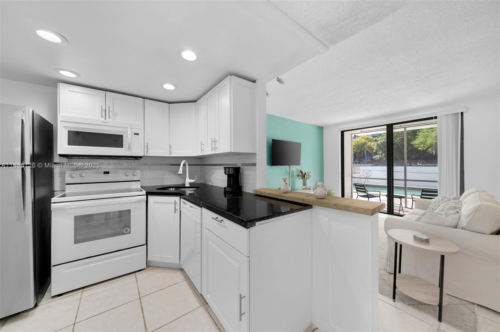First Floor unit with a covered parking spot by the front door. Fast approval. This unit is fully furnished and has everything that you need. Beautiful and spacious 802 sq ft, 1 bedroom/1.5 baths unit with assigned covered parking spot. Section 8 tenants welcome. Gorgeous unit with granite counter tops in the kitchen, nice appliances, tile floors, large patio facing the pool, plenty of closets. Enjoy living on a serene street, walk to Arch Creek East Environmental Preserve. Take long walks with your pets, walk to shopping plazas and Starbucks.