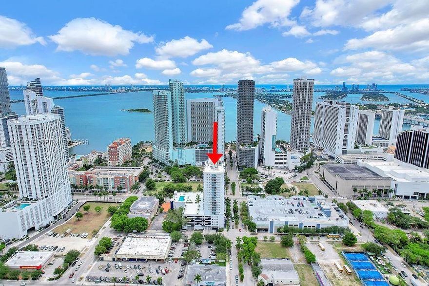 Live in the heart of Edgewater in this oversized corner residence at 1800 Biscayne Plaza, offering 2 bedrooms, 1 bathroom, and 1,171 square feet of bright and flexible living space. Floor to ceiling windows, high ceilings, crown molding, and a modern kitchen with stainless steel appliances create an airy and inviting feel, while the versatile den easily works as a second bedroom, home office, or studio. Enjoy skyline views from your private balcony and the rare convenience of parking just steps from your door with no elevator needed. With no direct neighbors on your floor, privacy is unmatched. Residents enjoy 24 hour security, fitness center, and a brand new pool. Ideally located near Publix, Margaret Pace Park, Wynwood, Midtown, and the Design District, this home places you close to waterfront parks, walking trails, tennis and volleyball courts, dog friendly spaces, luxury shopping, art district, restaurants, cafes, and nightlife. One of the best opportunities for buyers seeking an Edgewater condo with space, flexibility, walkability, and short term rental potential in a central Miami location. Short term rentals allowed with 30 day minimum. Building has Reserves and all renovations are completed. Margaret Pace Park features waterfront walking trails, tennis, volleyball, outdoor gym equipment, and dog friendly amenities, while the Design District highlights fashion, art, architecture, and dining.