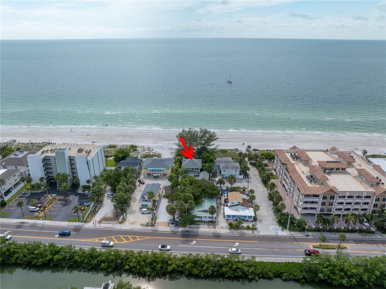 This sought-after beachfront rental is a guest favorite with repeat visitors. Walk to restaurants, shops, water parks, and yes—ice cream! This beautifully curated duplex (1 bed/1 bath units up and down) combines coastal charm with modern upgrades like new AC units, mini-splits, a water heater, and updated electrical. Zoned for short-term rentals, it’s ideal for making memories and generating income—reservations are already in place! Set on nearly 1/3 acre and zoned for up to 10 units, it offers rare potential. Main house: ~2,648 sq ft; downstairs unit: ~448 sq ft; upstairs unit: ~225 sq ft. See floor plans in photos. Buyer to verify all room sizes.