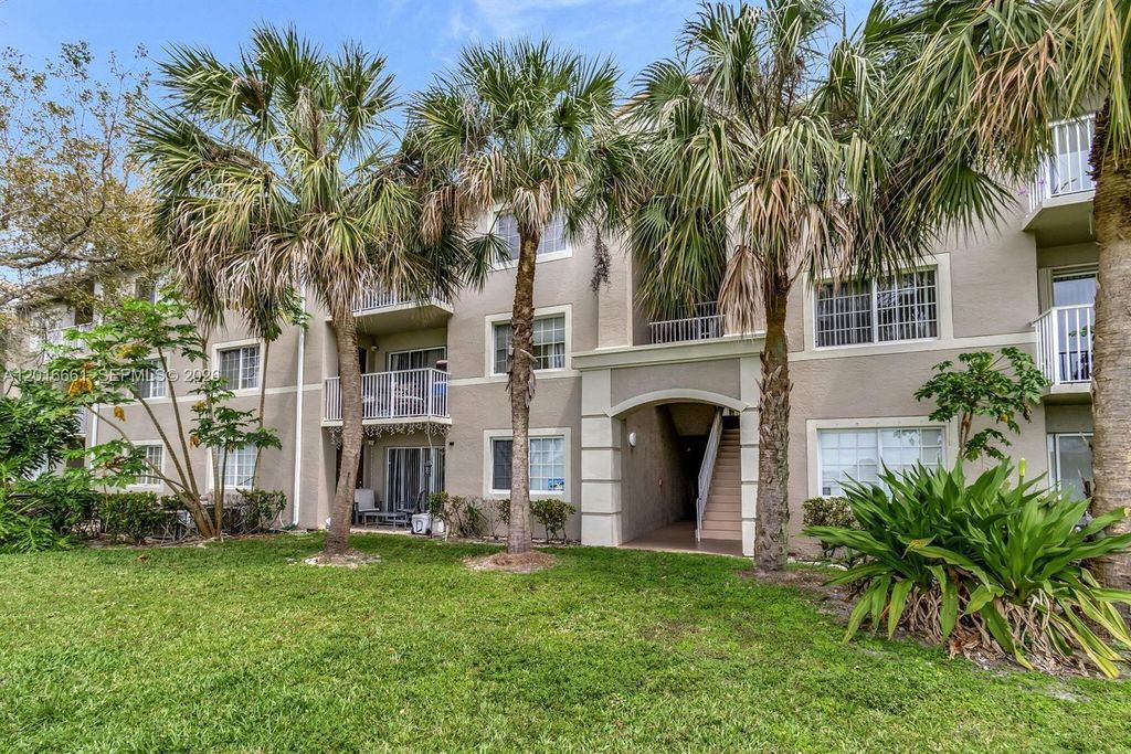 Photo of 5045 Wiles Rd #201, Coconut Creek, FL 33073 (MLS # A12016661)