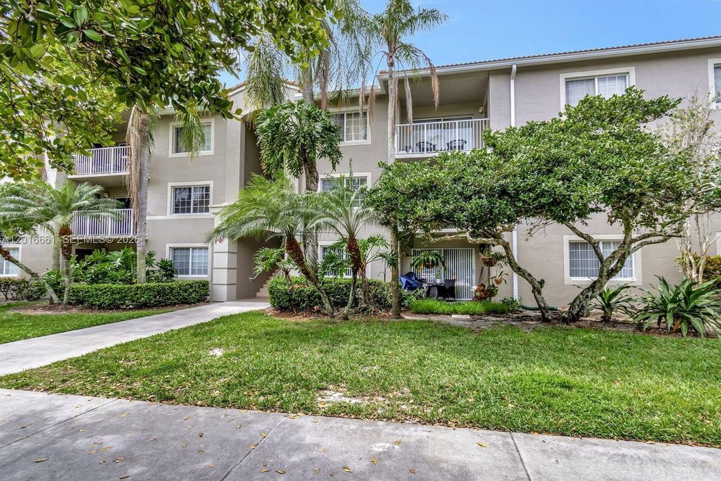 Photo of 5045 Wiles Rd #201, Coconut Creek, FL 33073 (MLS # A12016661)