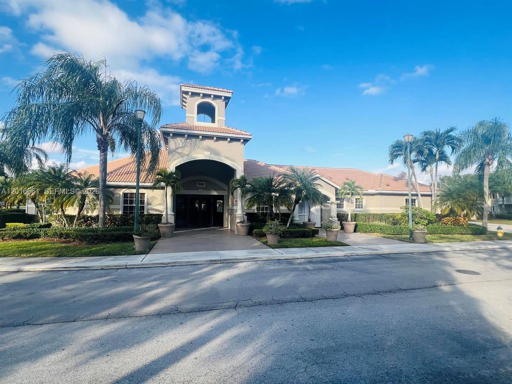 Photo of 5045 Wiles Rd #201, Coconut Creek, FL 33073 (MLS # A12016661)