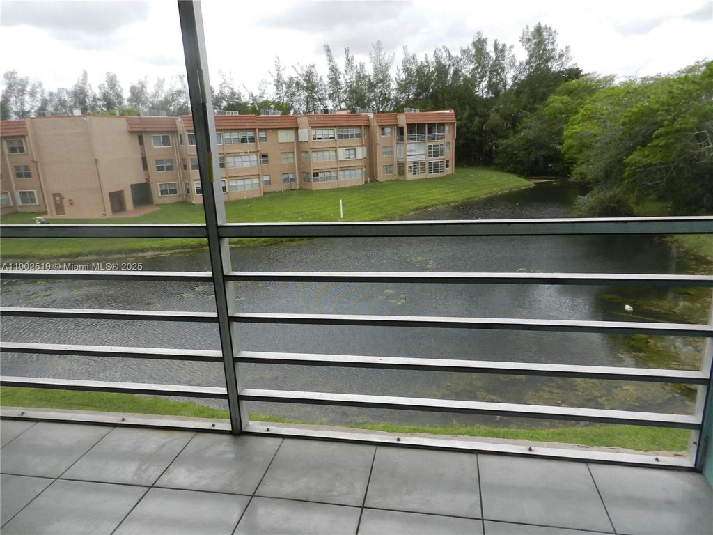 Photo of 9661 Sunrise Lakes Blvd #305, Sunrise, FL 33322 (MLS # A11902519)