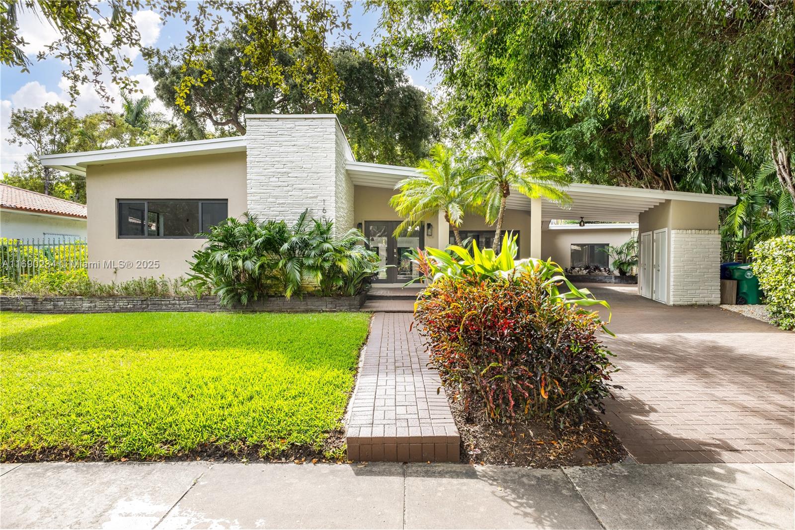 Nestled in one of Coconut Grove's most coveted communities, this beautifully remodeled home offers 4 bedrooms and 4 bathrooms. The open and spacious floor plan flows seamlessly, surrounded by lush landscaping. Highlights include a fully equipped kitchen and a large laundry room, blending style and functionality for modern living.