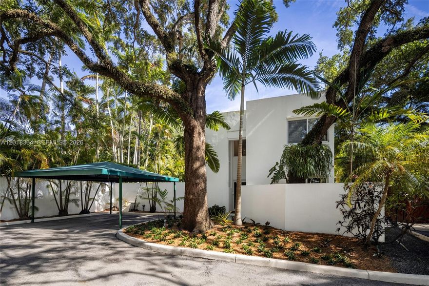 Tucked in a gated enclave in the North Grove, this residence features award-winning architecture that feels both modern and tropical. Set at the back of a community of just three homes, you’ll enjoy privacy and tranquility. The living room offers double height ceilings with natural light and seamless indoor-outdoor flow with impact windows and doors. A renovated kitchen with large pantry and adjacent dining room with built-in bar opens out to a soaring patio and beautifully landscaped and walled yard with hot tub or room for a pool. One bedroom downstairs and two upstairs, including the generous primary suite with walk-in closet and spa-like bathroom. A rare opportunity to own in an intimate, gated community while enjoying the waterfront culture, dining, and lifestyle of Coconut Grove.