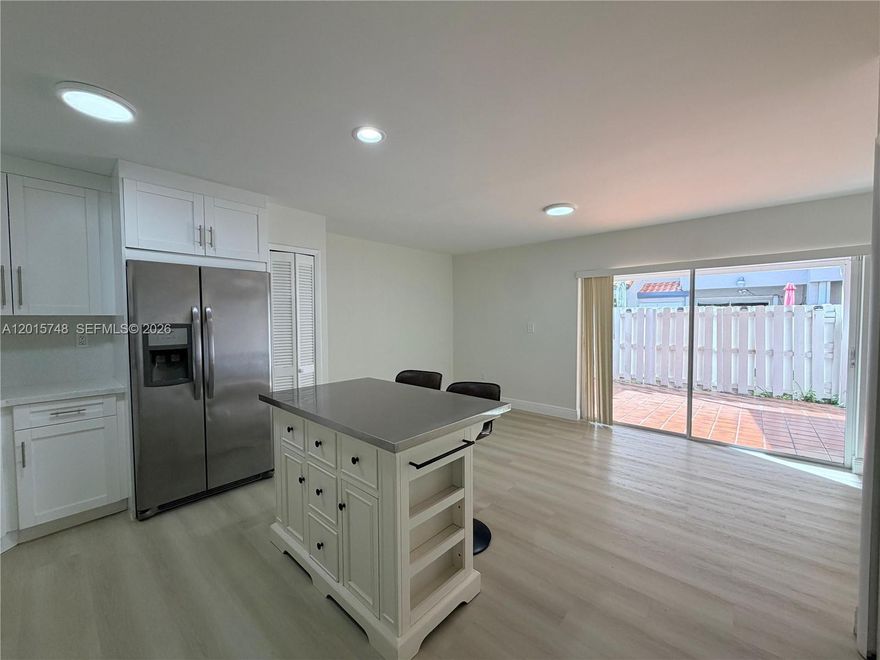 Charming and beautifully updated and move-in ready Townhouse featuring 3 bedrooms and 2.5 bathrooms. This cozy home offers a modern updated kitchen, new flooring installed in 2023, freshly painted interiors, and a spacious, welcoming layout. New roof and A/C 2022. Washer and Dryer from 2023. Enjoy the private backyard patio/terrace area, perfect for relaxing or entertaining. A true gem combining comfort, style and functionality.