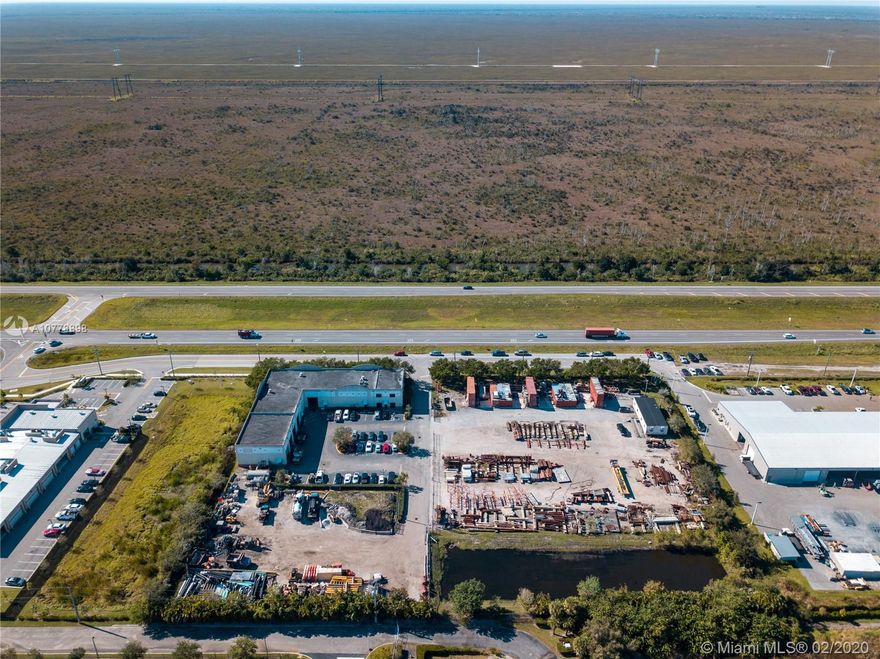 This 15,245 SF warehouse & office within 4.33 Acres (zoned M-2) right US-27. 3,000 SF of office with impact windows. 20 ft & 25 ft clear ceiling height, sprinkled.  3 phase power - 270 amps. Acreage is filled and graded, ready for industrial use or storage. Fenced property, electric gate. 34 striped parking spaces.