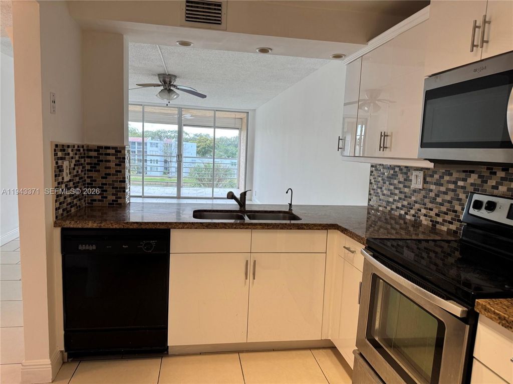 Photo of 1831 Sabal Palm Dr #403, Davie, FL 33324 (MLS # A11943371)