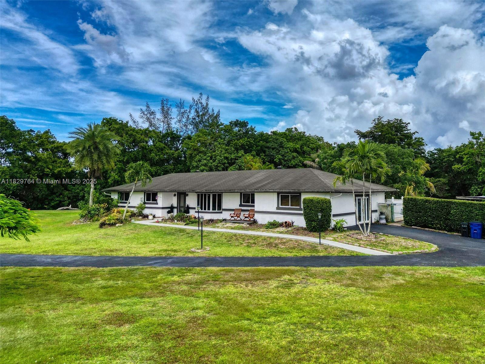 Gorgeous 5bd/3.5ba single story home on 2.46 ACRES OF LAND in one of the most sought after communities in South Florida! Like living in the country but close to the cities and highways, restaurants, shopping and more. Stunning tropical private fenced backyard with pool oasis. Two Master bedrooms, one with an oversized spa like bathroom. Hurricane impact windows, child play area, planter box garden with a water line leading to the garden area. 3 large chicken coops with runs. Plenty of parking. NO HOA!
Enjoy this beautiful home offering peaceful indoor and outdoor lifestyle!
**Per seller, the measured square footage of the home is approximately 3,306 sq. ft., which differs from the county tax roll record of 2,872 sq. ft. Buyers are encouraged to verify square footage independently.