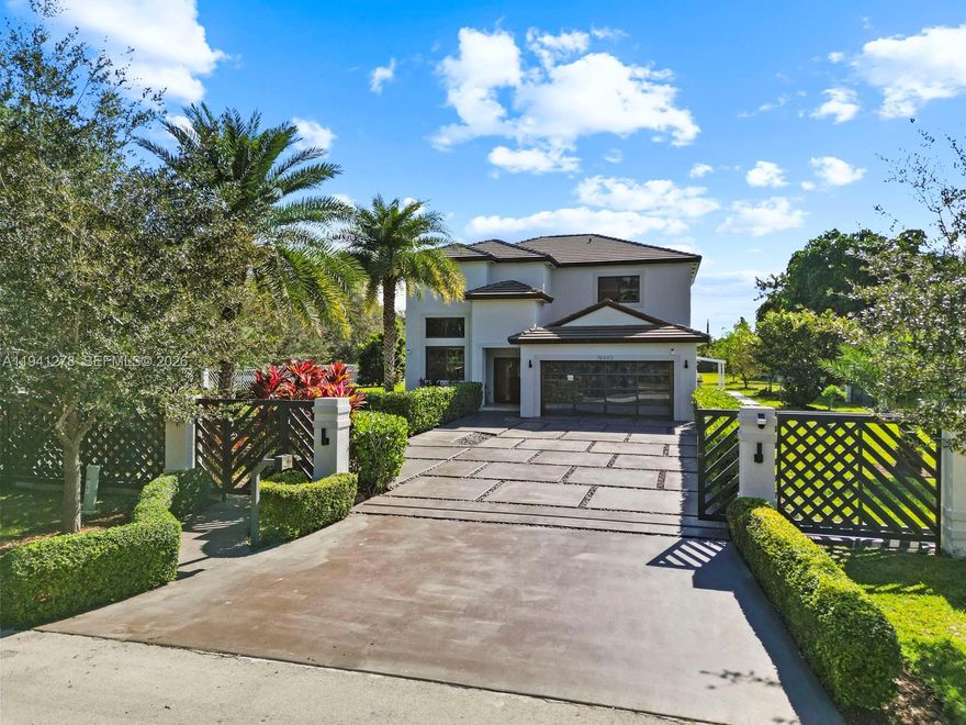 Estate home with less than 7 years of being built on a corner lot. Featuring 5 bedrooms, 3 bath pool home with spa. Hurricane resistance doors and windows, electric gate entrance, 35,785 sq ft lot with side entrance to slab for RV or boat with electricity, security camera system, irrigation on well. Main bedroom features two walk-in closets with built-in, separate tub & shower with bidet & double sinks.