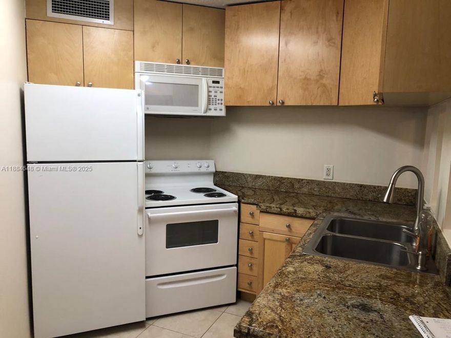 Two bedroom, two bath unit in Lake Pointe Condo. Located on the first floor. Tile floors throughout, granite counter tops, updated bathrooms, screened porch overlooking garden area. 1 assigned parking space and guest parking available. No pets. Master bedroom has a walk-in closet. Washer/dryer in unit. Community has gated entry, lake, security, 2 pools, club house and tennis court. Unit is rented until 11/30/25 $1850 monthly. NO BUYER APPROVAL NEEDED FOR HOA.