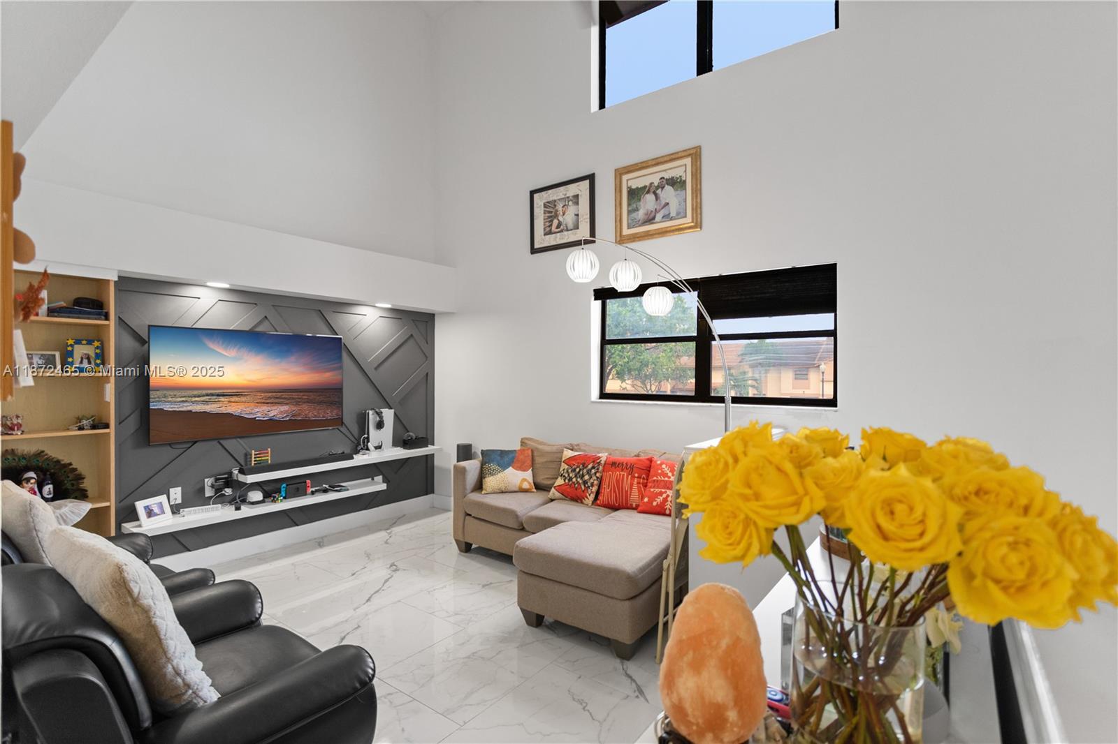 Step inside this spacious Townhome and fall in love with its modern updates. The first floor features two bedrooms that share a full bath. There is also a private screened-in patio, for relaxation. The second level is the heart of the home featuring an open concept living, Dining and kitchen area. A half bath is also located on the same floor. The top floor is a master retreat with walk-in closet, full bathroom and a private balcony. A/C 5 Years old. LOW HOA. UPGRADED Features. Well maintained community.