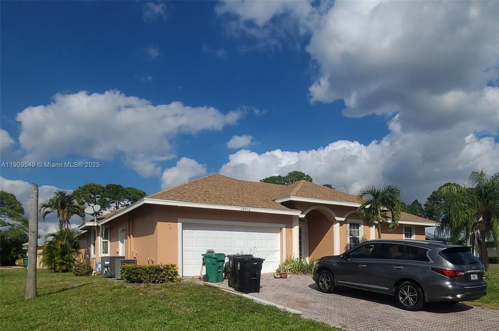 Photo of 1881 SW Elijah Ave, Port St Lucie, FL 34953 (MLS # A11909549)