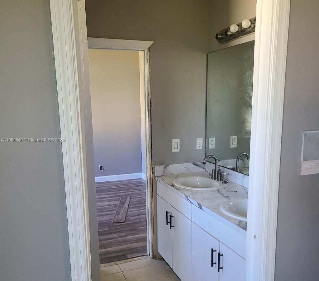 Photo of 1881 SW Elijah Ave, Port St Lucie, FL 34953 (MLS # A11909549)