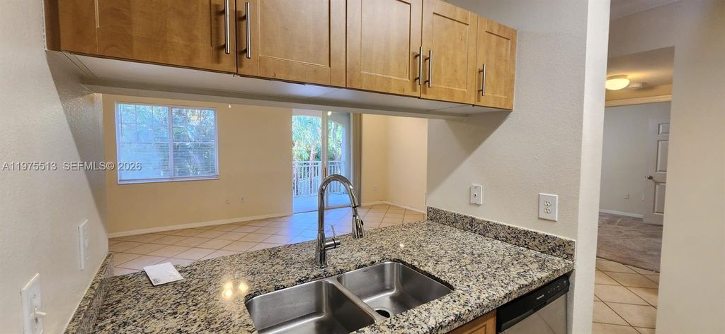 Photo of 6530 Emerald Dunes Dr #207, West Palm Beach, FL 33411 (MLS # A11975513)