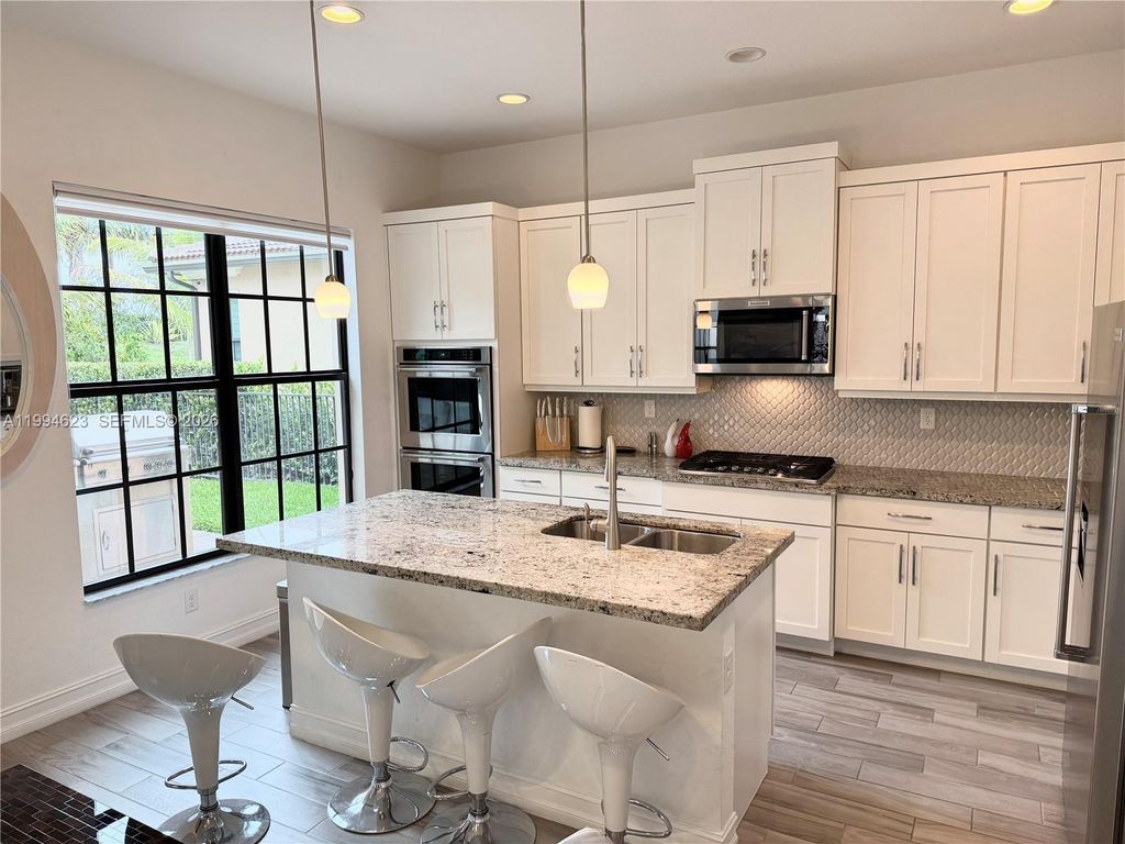 Photo of 11455 Solstice Cir, Parkland, FL 33076 (MLS # A11994623)