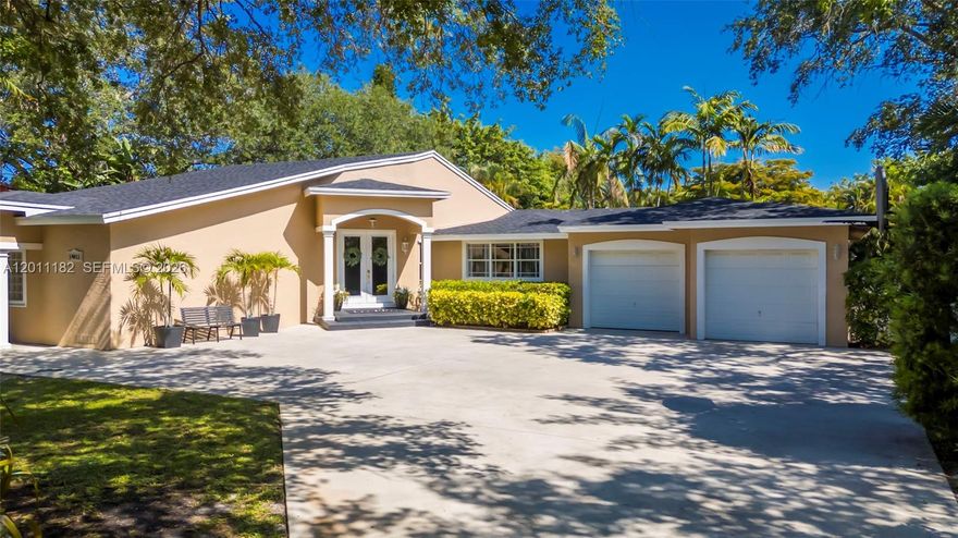 Spacious and beautifully updated one-story home situated on a full builder’s acre, offering 4 bedrooms, 3 bathrooms, and a BRAND NEW ROOF, with an ideal layout for both everyday living and entertaining. A long, oversized driveway provides ample space for multiple vehicles, boats, or toys, leading to an expansive 1,100 sq ft oversized garage—perfect for a workshop, storage, or all your recreational needs. Inside, you’re welcomed by soaring vaulted ceilings in the main living area, creating a bright and open atmosphere. The kitchen is generously sized and features a window overlooking the backyard, seamlessly connecting to the dining area with French doors that open to the outdoor patio. The primary suite offers plenty of space, walk-in closet, and a spa-like bathroom complete with a large walk-in shower and rainhead. A massive secondary bedroom provides flexibility as an in-law suite, guest retreat, or playroom, while two additional guest bedrooms are well-sized—one with a private bathroom and the other sharing a full bath with the main living areas. Step outside to a large backyard with a spacious patio and endless potential—perfect for adding a pool, outdoor kitchen, or creating your dream outdoor oasis. The property is also equipped with a full irrigation system to keep the grounds lush and well-maintained year-round.