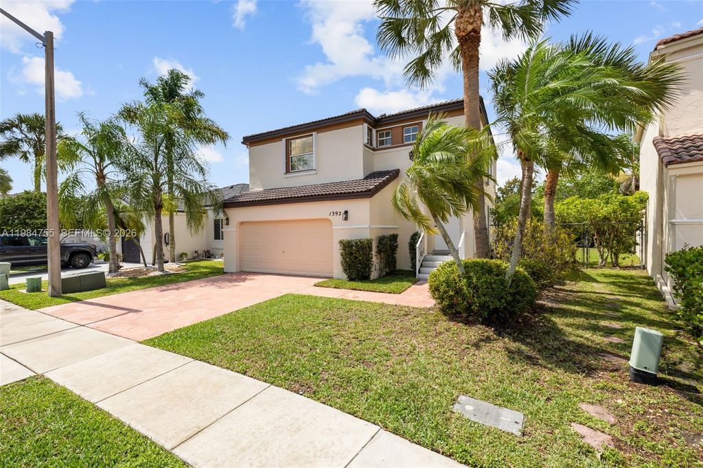 Photo of 1392 NW 159th Ln, Pembroke Pines, FL 33028 (MLS # A11984755)