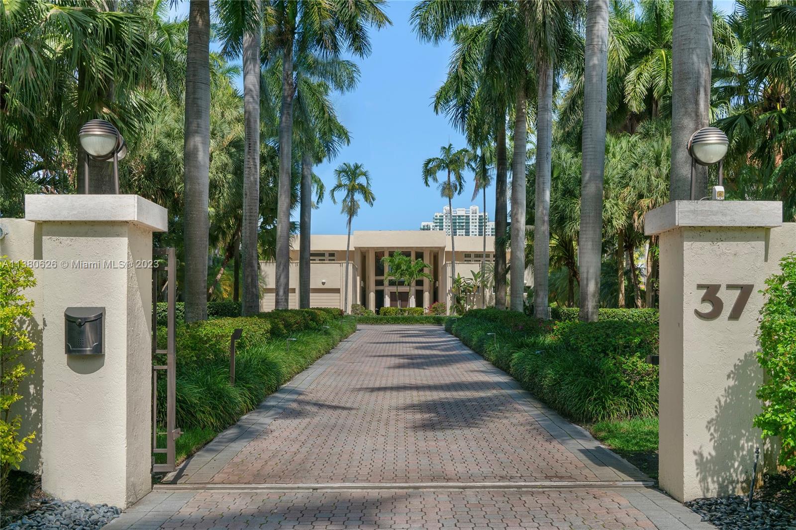 Located on exclusive guard-gated Star Island this residence boasts a manicured 40,000 SF lot, and actual area of 12,374 SF, 6BR plus an office, 8+1BA, and 100FT of sparkling waterfront. Impressive foyer with soaring 30+FT ceilings and custom staircase, exquisite Travertine floors and custom millwork throughout, expansive living room and entertainment room/bar all with large windows and amazing views to the pool and bay. A private dining area, chef’s kitchen with top-of-the-line appliances and a separate breakfast room. The large bay-facing principal suite features dual walk-in closets and dual bathrooms. Upstairs has 4 large guest bedrooms with en-suite baths & oversized Plaza Deck terraces. Heated pool, summer kitchen, 40FT dock, direct bay & ocean access plus amazing central location.