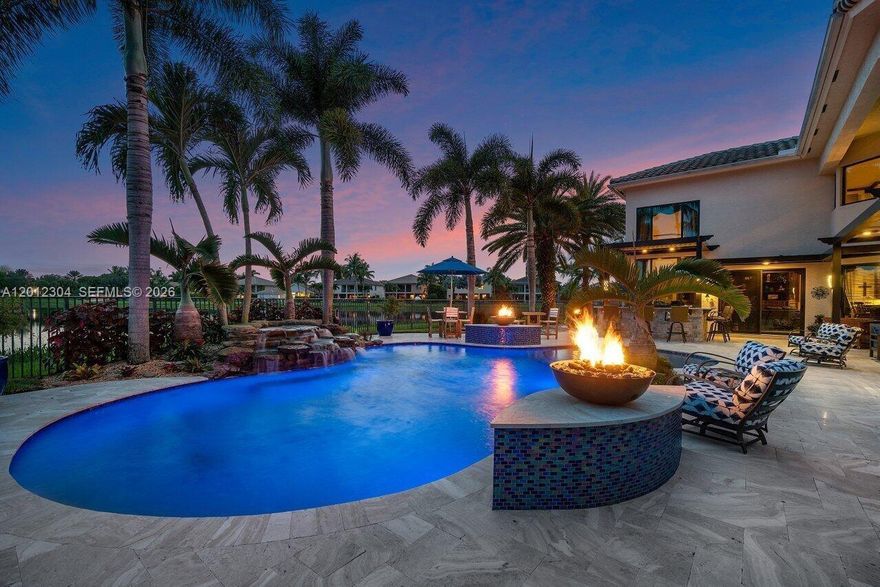 Your private slice of paradise awaits on the premier lot in the community. Perfectly positioned on a secluded cul-de-sac, this exceptional Preston Model showcases breathtaking panoramic lake views and an unparalleled sense of privacy.
Offering 6 bedrooms, 5.5 bathrooms, and a 3-car garage, this residence is thoughtfully designed for both comfort and sophistication. The ideal floor plan features a private downstairs primary suite wing, along with a separate main-level guest suite, perfect for multi-generational living or hosting with ease.
The home is enhanced by a newly redesigned dining room featuring a striking granite accent wall, adding a refined, modern touch. At the heart of the home, the chef’s kitchen flows seamlessly into an expansive family room, complete with custom built-ins and oversized windows that fill the space with natural light while framing serene lake views.
Step outside to your resort-style backyard oasis, where a sparkling pool, covered patio, and outdoor entertainment bar create the perfect setting for year-round relaxation and entertaining.
Additional highlights include access to top-rated A schools and resort-style community amenities, including a fitness center, pool, playground, and tennis courts.
A rare opportunity to own one of the most desirable lakefront properties in the community, this is South Florida luxury living at its finest.