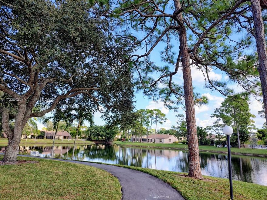 MINIMUM OF 3 MONTHS. A beautifully maintained second-floor apartment with 2 beds and 2 baths is in the desirable 55+ Pine Ridge South IV community. The unit features a screened patio with accordion shutters to enjoy your morning coffee, a spacious living/dining area, nicely-sized bedrooms with their own walk-in closet, and an updated primary bathroom and Shower. The A/C is 4 years old, the water heater is 3 years old, and a NEW refrigerator and dishwasher. Has a full-size washer and dryer. The amenities include a spacious clubhouse, a large heated pool, bocce ball, shuffleboard, and a pathway around the lake. The amenities include a spacious clubhouse, a large heated pool, bocce ball, shuffleboard, and a pathway around the lake, ensuring a vibrant and enjoyable lifestyle.