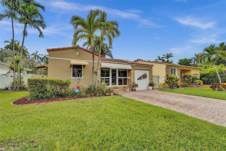 Charming 2-bed, 2-bath home in a desirable location! Step into the enclosed front porch & be greeted by vaulted ceilings, rich wood floors & a spacious layout that feels like home. The living room flows seamlessly into a formal dining area with triple sliding doors that open to a beautiful backyard. Kitchen features a granite countertop, dark stainless steel appliances, double stainless sink & ample cabinetry. Converted garage currently used as a den. Both bathrooms are tastefully renovated—one with a walk-in shower, washer & dryer, and new vanity, the other with a shower/tub combo, updated sink & Toto toilet. Fully fenced backyard with room for a pool, a wood deck with a tranquil pond & jacuzzi, two storage sheds & a new tile roof (approx 16 months old)