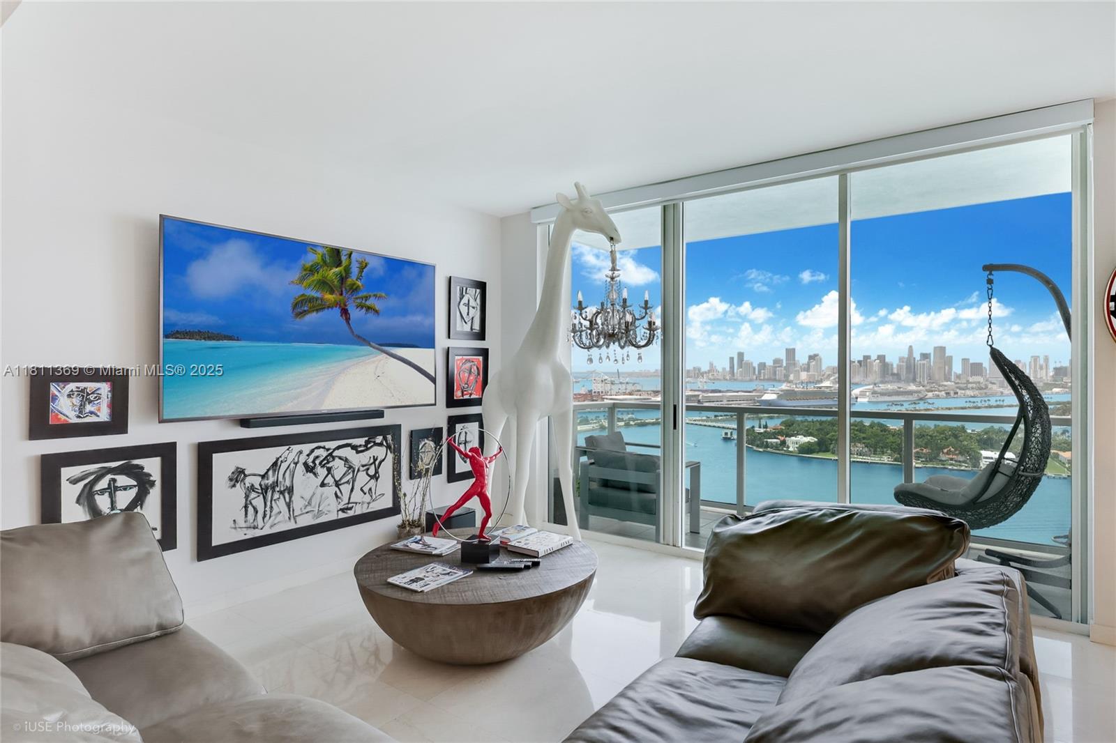 Experience ultimate luxury with this exclusive PH level residence at The Floridian, offering panoramic skyline and bay views through floor-to-ceiling windows in every room. Each
space opens to private balconies, enhancing the indoor-outdoor living concept and capturing in the sunset views. Marble flooring throughout entire unit. The kitchen features a
stunning waterfall counter with built-in lighting, wine cooler, and sleek stainless steel appliances. The opulent primary suite boasts a spa-inspired bathroom and an expansive custom
closet. Indulge in resort-style amenities—including two pristine pools, a state-of-the-art gym, tennis courts, 24-hour valet, and a private boat dock. Two parking spaces included.
Premier location within walking distance of world-class dining and nightlife.