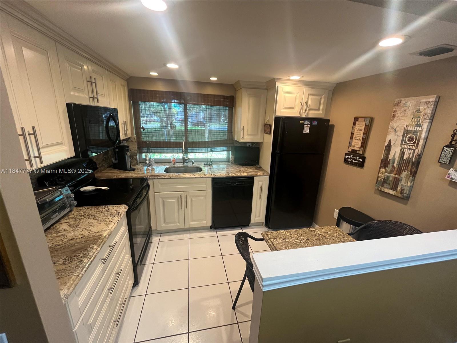 Well-maintained sought-after corner 2/2 unit in Lime Bay (55+) with assigned parking right outside front door. Tile/vinyl floors throughout. Ceiling fans in all rooms. Updated kitchen and master vanity. All windows have hurricane shutters. Newer enclosed lanai with floor to ceiling hurricane impact windows. Furniture and decor negotiable with sale. One dog under 15 lbs. permitted. Lots of community activities and social events. All information deemed accurate, buyer/agent to confirm.