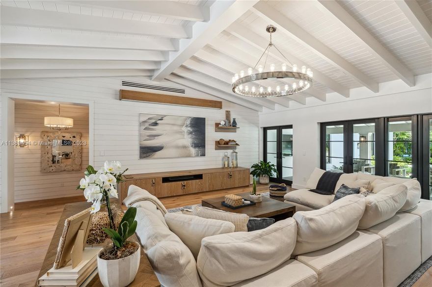 As you step into Casa Paraiso, you're transported to a tropical paradise in Miami. This one-of-a-kind home, completed in 2021, that comes FULLY FURNISHED draws inspiration from the Caribbean Islands. With over 7,000 sq ft of living space, the outdoor area is breathtaking, featuring an 11ft lagoon pool, fire pit, tennis/basketball court, and outdoor BBQ/pizza kitchen. Inside, enjoy exquisite nautical and warm interiors that boast high vaulted ceilings, a chef's gas kitchen, a private dining area, a 300-bottle wine cellar, a dream garage, beautiful blonde oak wood floors, custom millwork, and seven luxurious suites. Casa Paraiso is minutes from top restaurants and premier shopping, offering the perfect blend of tropical luxury and city living.