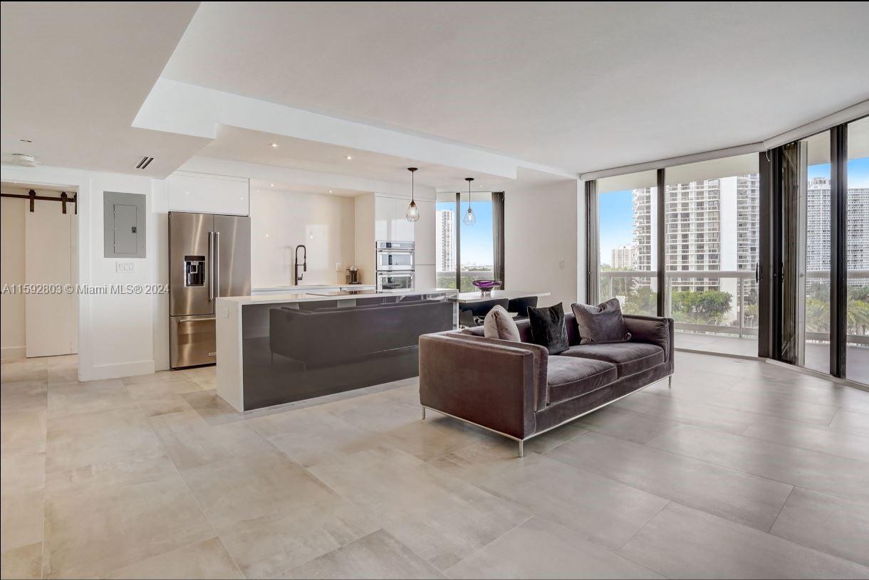 LUXURY BUILDING on the circle boasts a complete remodeled open concept 8th floor beauty. Enjoy intracoastal and ocean views as you sit on your wrap around balcony in the City of Excellence. No expense has been spared in this beautifully curated unit which boasts porcelain tile throughout, state of the art appliances, luxury style bathrooms and more! Resort style living is calling your name as this condominium allows you to explore amenities that include pool service, spa, cafe, incredible gym, tennis, pilates classes, racqetball and more! The security is unmatched in Aventura and your valet is there to assist your with your needs as you are welcomed home each and every day. Call today to schedule a private tour!