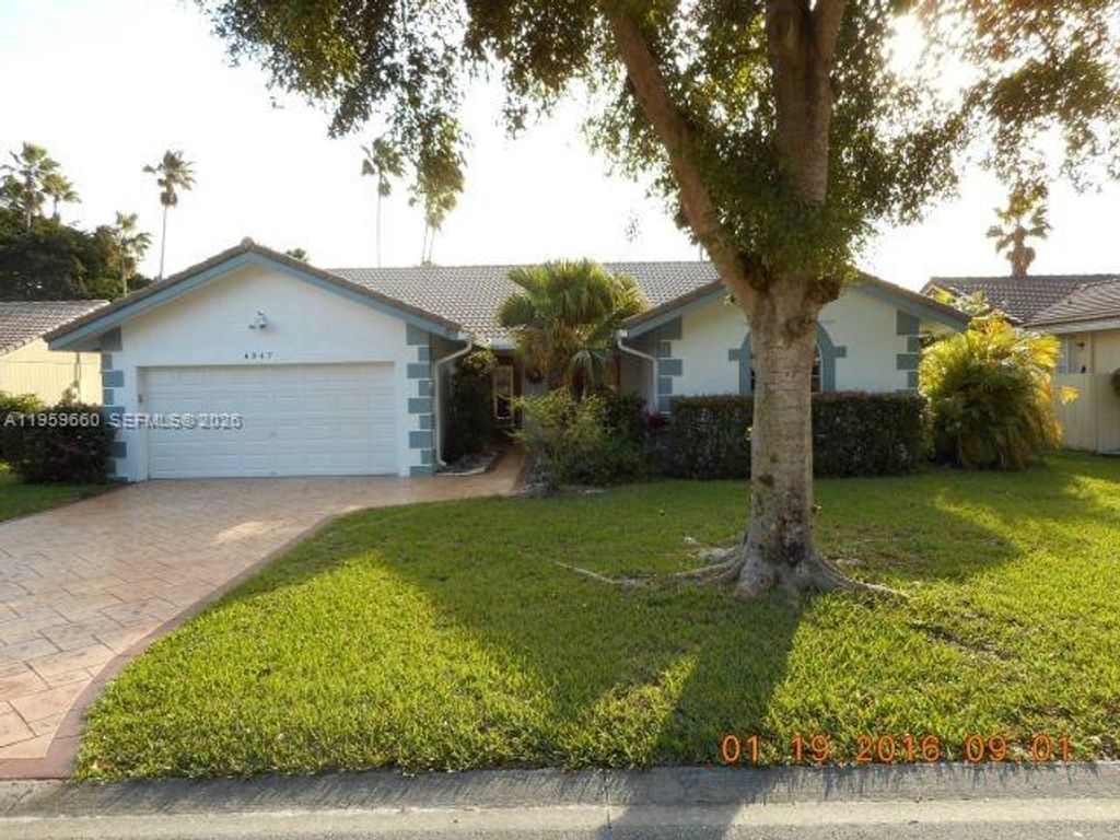 Photo of 4047 NW 115th Ave, Coral Springs, FL 33065 (MLS # A11959660)