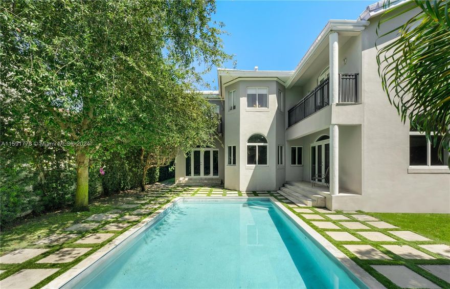 Charming two-story home on upper Alton Rd boasting 5 beds, 5 baths, and 3,392 sq ft of living space, nestled on a generous 7,538 sq ft lot. Step inside to a grand foyer entry with a captivating spiral staircase. The spacious kitchen flows seamlessly into the family room + a proper dining room, perfect for gatherings. Enjoy a formal family room and a refreshing pool in the private backyard. Upstairs, the primary bedroom features high ceilings, inviting ample natural light with walk-in closet. Conveniently located within walking distance to La Gorce Country Club, 20 min walk to the beach and short drive to Miami Beach Golf Course.