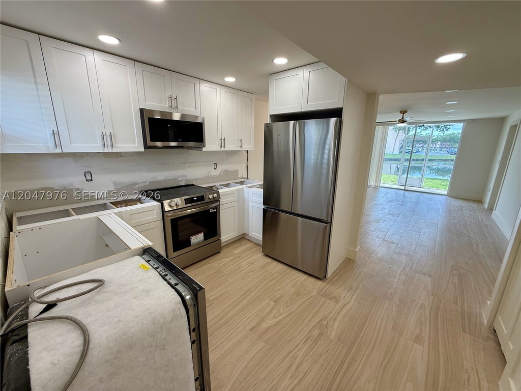 Photo of 8600 Sunrise Lakes Blvd #102, Sunrise, FL 33322 (MLS # A12047976)