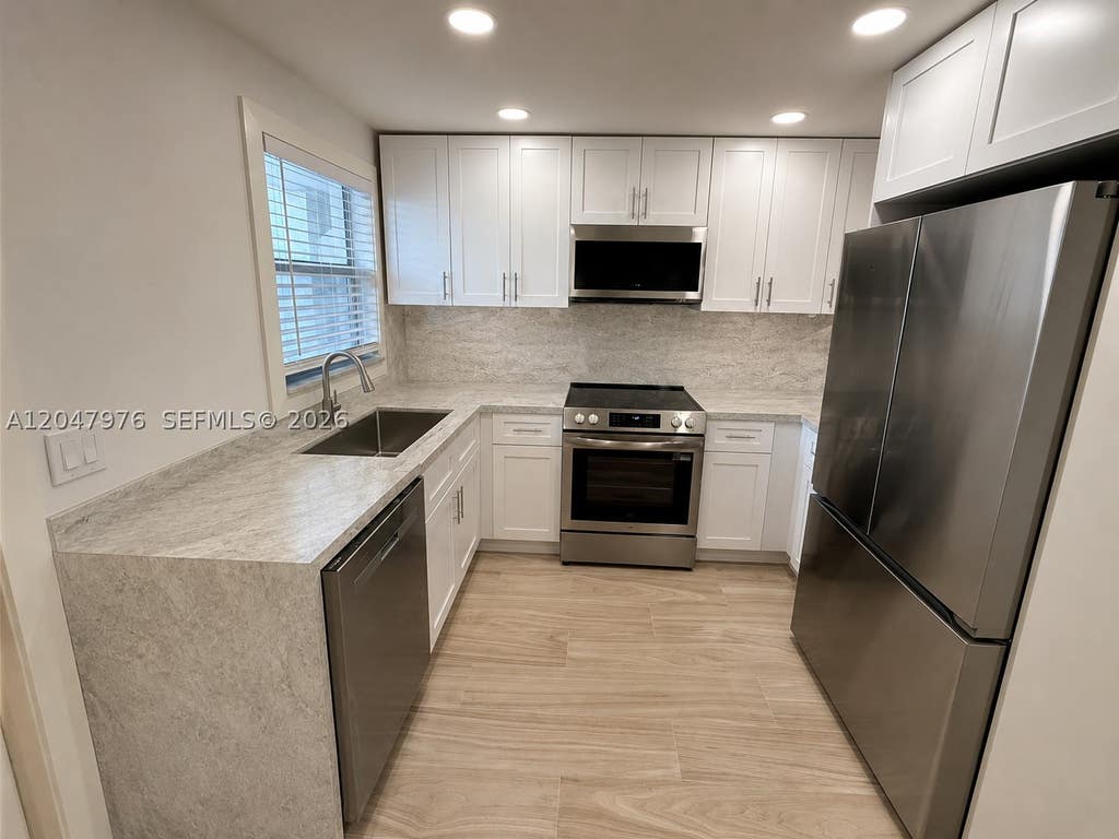 Photo of 8600 Sunrise Lakes Blvd #102, Sunrise, FL 33322 (MLS # A12047976)