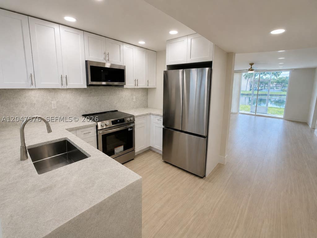 Photo of 8600 Sunrise Lakes Blvd #102, Sunrise, FL 33322 (MLS # A12047976)