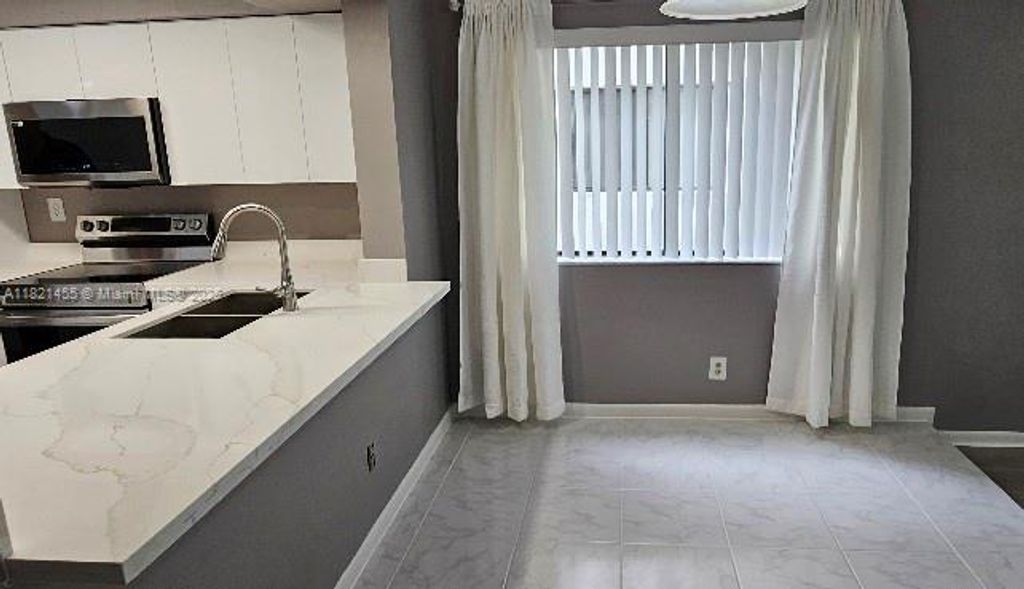 Photo of 3625 Coral Springs Dr #3625, Coral Springs, FL 33065 (MLS # A11821455)