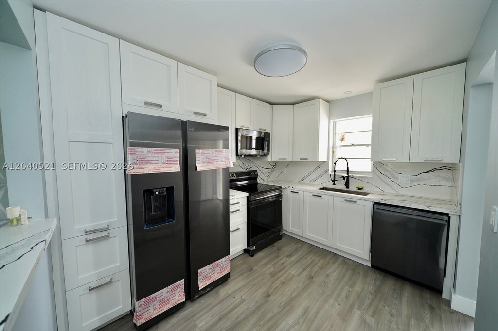 Photo of 2541 Aragon Blvd #305, Sunrise, FL 33322 (MLS # A12040521)