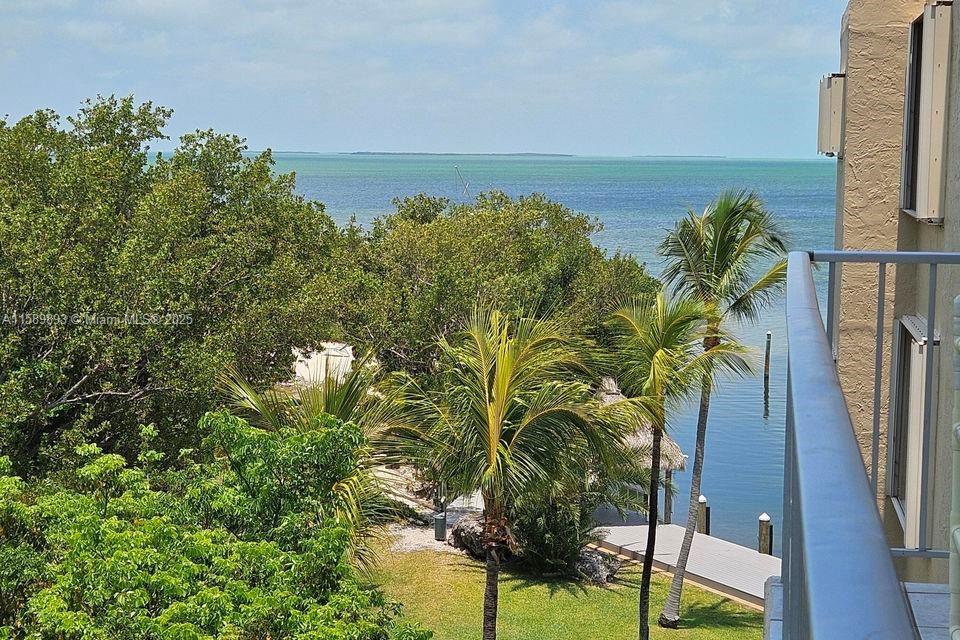 Welcome to Summer Sea, a bayfront community in Islamorada. This remodeled, fully furnished and "turn key" condo features breathtaking bay views from its large balcony, 2 bedrooms (with space for a 3rd), 2 bathrooms, a beautiful kitchen, ample closet space, a wet bar, and 1,148 sq ft of elegant living space. The open floor plan enhances space and light, perfect for living and entertaining. Summer Sea offers amenities including a renovated heated pool, sandy beach, first-come-first-served marina, boat and trailer storage, boat ramp, and fish cleaning station. Additional features include a rooftop deck, kayak storage, clubhouse with kitchen, and a new billiards room. Enjoy the best of bayfront living at Summer Sea.
