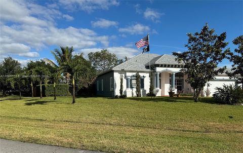 Single Family Residence in Port St. Lucie FL 620 Homeland Rd Rd.jpg