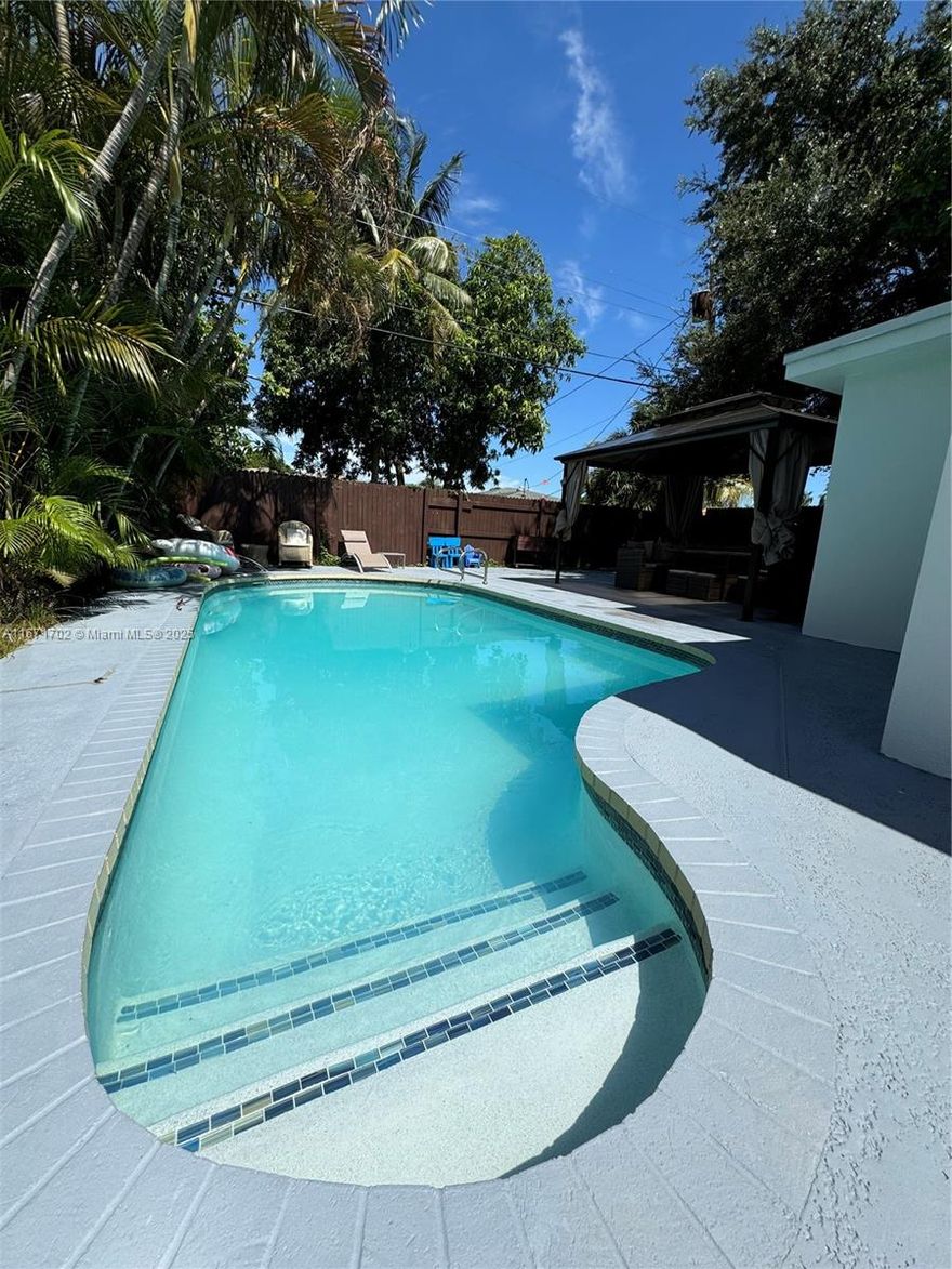 Enjoy this tropical paradise in the heart of North Miami Beach. Close to major arteries, schools and shopping centers, This stunning fully renovated designer home where no detail has been overlooked has beautiful marble floors throughout the entire home. The master suite with a walk-in closet overlooks the pool and patio with direct access through the impact sliding doors. This 3/2/1 home has new electrical and plumbing, new roof and all new appliances, new water heater, new A/C and new pool pump and pool heater. All windows and doors are impact resistant. There is a portable half bath for the pool area. The backyard is fenced in for total privacy. There's also a storage area and a gazebo.  Great for entertaining!  Actual square feet is greater than on tax roll. A true gem.