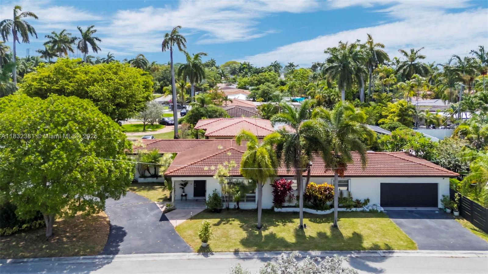 Beautifully maintained 3-bedroom, 3-full bath home with a separate den/office, ideally situated on a large prime corner lot just minutes from Northlake, Hollywood Beach and the Intracoastal. Expansive picture windows fill the home with an ample amount of natural light. Enjoy plenty of parking space with a 2-car garage, 2-car driveway, and circular driveway offering space for 7+ vehicles or recreational/boat/RV storage. Recent upgrades include a newer roof, A/C, water heater, and freshly painted interior and exterior. The fenced backyard features lush landscaping with mature banana, lime, mango and orange trees. Conveniently located near Downtown, top-rated restaurants, shopping, and Fort Lauderdale Airport.