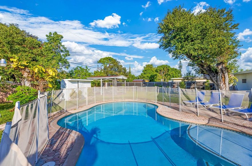 This charming 4-bedroom, 2-bathroom home at 38 Miami Gardens Rd in West Park, Florida, offers a perfect blend of comfort and convenience. Nestled near major highways like the Florida Turnpike and I-95, this property provides easy access to Miami and Fort Lauderdale airports. The spacious living area is ideal for relaxation and entertaining, complemented by a well-maintained kitchen. Outside, a sparkling pool with a surrounding fence ensures safety, and a shed in the backyard provides additional storage. The home comes fully furnished with all appliances included. Located just a 15-minute drive from Hard Rock Stadium, it offers suburban tranquility with urban accessibility.