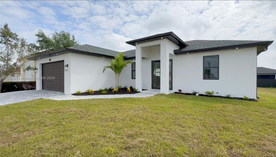 Seller is offering 6% towards Buyer's Closing costs and Prepaids! This new construction home in Cape Coral comes with a 5% seller credit that can be used toward closing costs, prepaids, or other allowable buyer expenses—giving you more flexibility at closing. Uncover the allure of "Moon" in Cape Coral, Florida. This modern masterpiece features 3beds, 2baths, & 1,387 sqft of luxury. The spacious master suite includes walk-in closets & dual-sink master bath. Inside, enjoy elegance with low-maintenance large-format tile floors & high ceilings that amplify space. The open kitchen seamlessly connects to the living & dining areas, perfect for hosting or everyday living. The 227 sq ft lanai, an outdoor oasis for morning coffees or unwinding. The 2-car garage boasts durable epoxy floors.