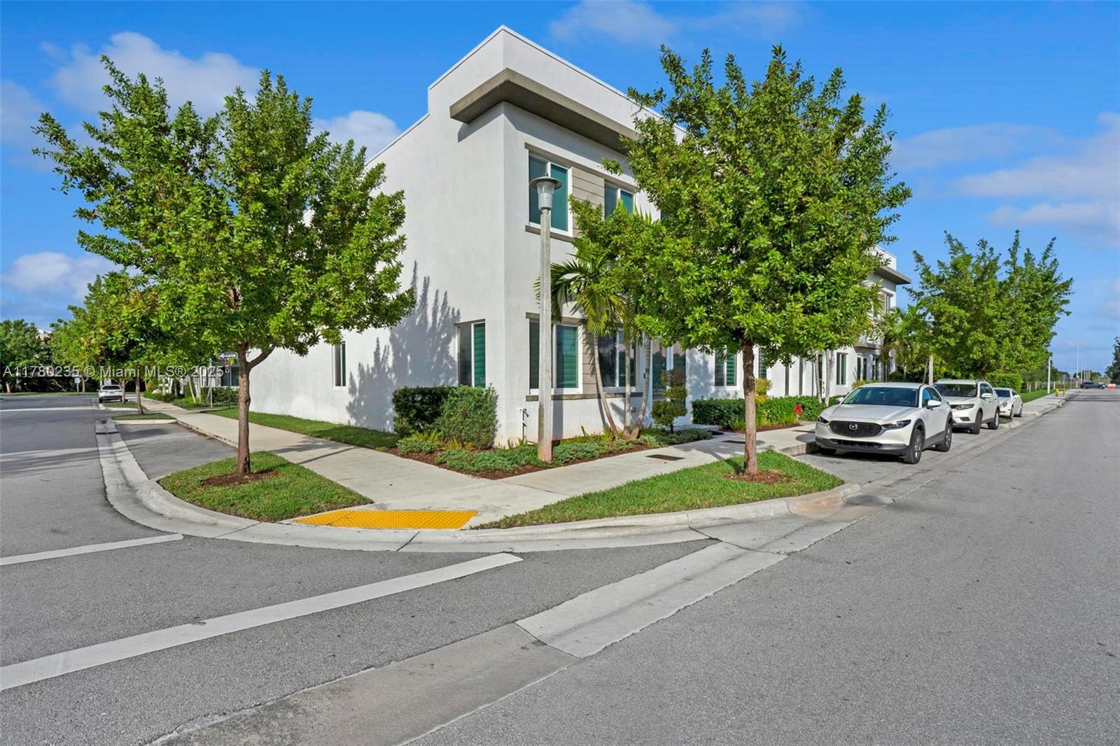 Rare opportunity in Doral! Corner townhome – Lennar’s J Next Gen model (2020) – located directly across from the Landmark clubhouse. This unbeatable location makes it feel like both the main home and the private studio enjoy the full resort-style amenities just steps away — a true extension of the living space. The layout offers two fully independent entrances: a 3-bed main home and a private studio with its own kitchen and bath. Both units can be legally rented separately (HOA approved). Features include large-format porcelain tile, impact windows, quartz countertops, stainless steel appliances, custom closets, and a 2-car garage. Best way to contact is via email or WhatsApp. Visits by appointment only. Strong rental potential for investors.