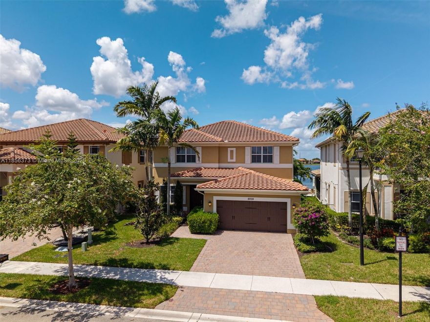 Step into elegance in the prestigious gated enclave of Miralago, Parkland. This exquisite residence offers resort-style living with a grand clubhouse and serene lake views. The designer heated pool invites you to unwind or host unforgettable gatherings under the Florida sun. Curated by Steven G Interiors, the home showcases impact windows and doors, sleek granite finishes, a cabana bath, and a spacious two-car garage. With four bedrooms and four bathrooms, including a lavish master suite with walk-in closets and spa-like ambiance, every corner is crafted for comfort and privacy. Best of all, this Turn Key home comes fully furnished with impeccable style! Experience refined living in one of South Florida’s most desirable communities—where luxury meets lifestyle.