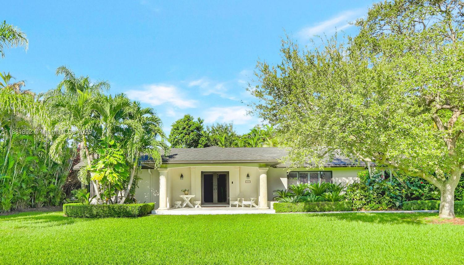 This updated and lovingly cared for beauty offers tremendous buyer appeal with its open layout, featuring 5 bedrooms, 3 baths, and complete impact windows and doors. A custom front porch welcomes you into spacious light-filled rooms with beautiful finishes. The kitchen showcases a vaulted ceiling, an island over 12 feet in length for entertaining, a 48in 6-burner 2 oven gourmet gas range with griddle and warming drawer, and an abundance of cabinetry. Buyers will love the wet bar buffet with cooler. An electric fireplace adds to the home's ambiance. Two extra spacious primary bedrooms are a rare find, a Jack and Jill bath, and cabana bath. To top it off, the resort-style pool boasts a waterfall and Baja shelf, surrounded by a palm oasis and lush lawn. This truly impressive gem awaits you!