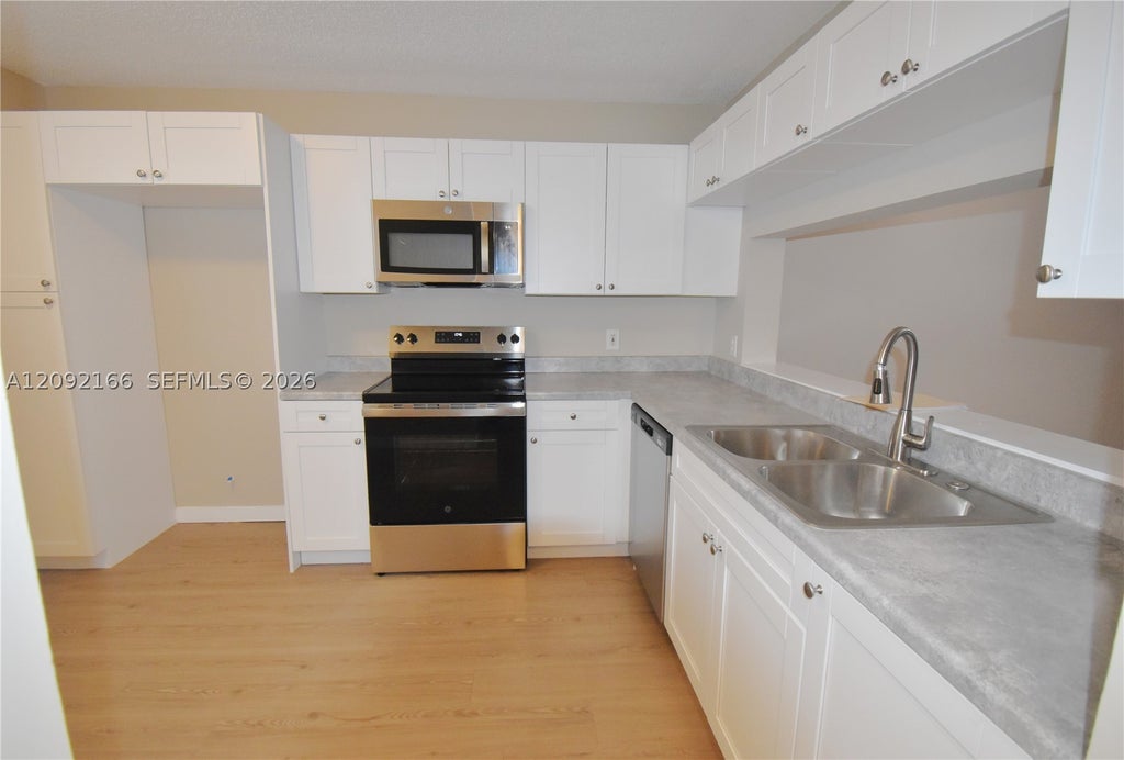 Photo of 10360 NW 30th Ct #405, Sunrise, FL 33322 (MLS # A12092166)